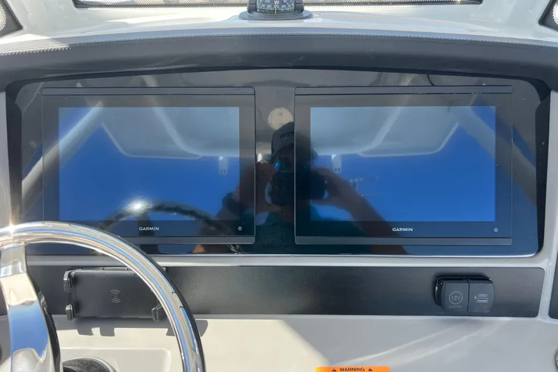 Slide: The Image of 2026 Robalo R250 Center Console with dual Garmin displays on the dashboard. - 6
