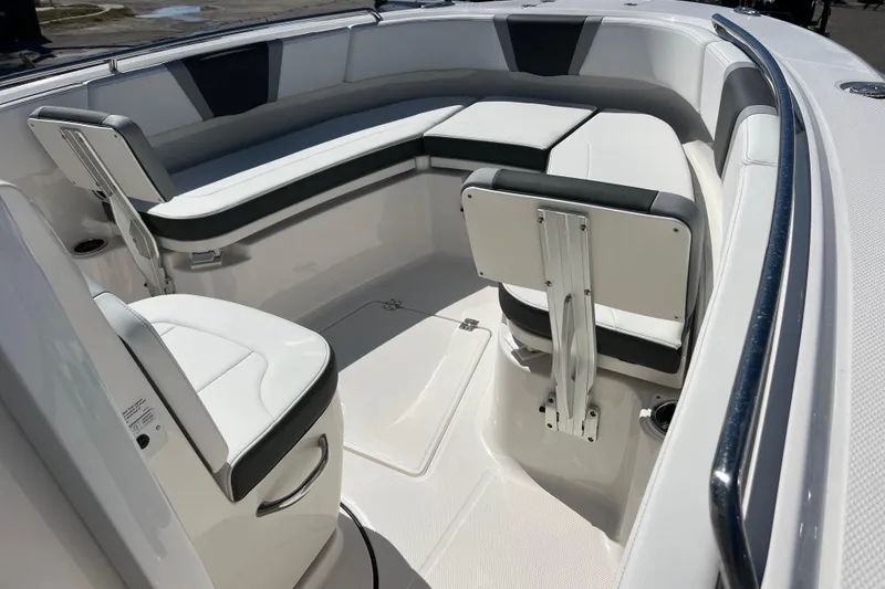 Slide: The Image of 2026 Robalo R250 Center Console boat interior with cushioned seating and sleek design. - 7