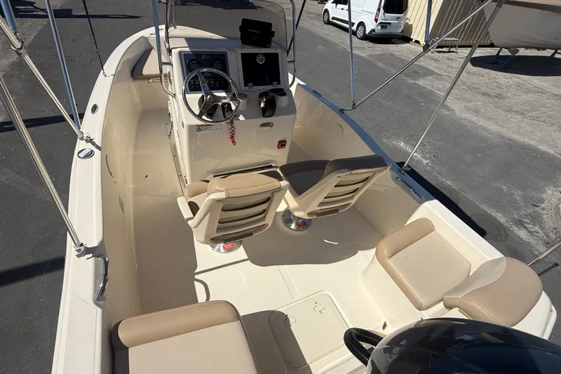 Slide: The Image of 2022 Scout 175 Sportfish boat interior with steering console and seating. - 8