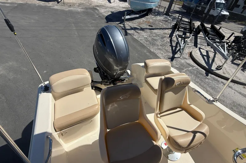 Slide: The Image of 2022 Scout 175 Sportfish boat interior with seating and outboard motor. - 9