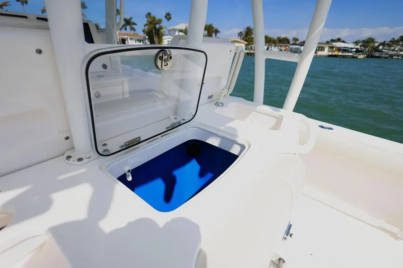 Slide: The Image of Everglades 355 Center Console 2015 with open storage compartment by the water. - 11