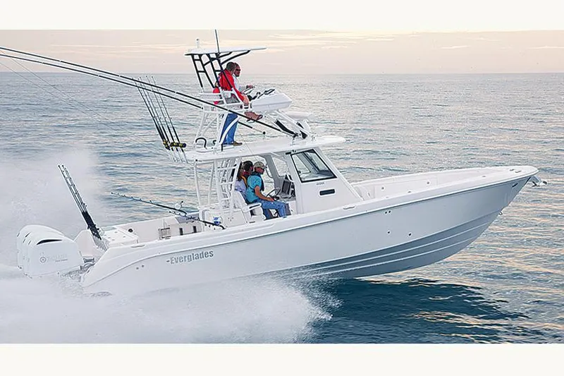 Slide: The Image of 2015 Everglades 355 Center Console boat on calm water, distant shoreline visible. - 2