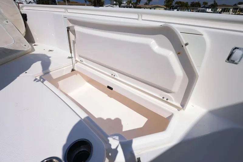 Slide: The Image of Open storage compartment on 2015 Everglades 355 Center Console boat deck. - 31
