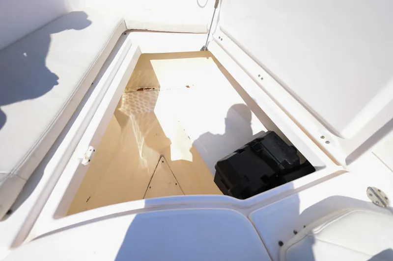 Slide: The Image of Open storage compartment on 2015 Everglades 355 Center Console boat. - 32