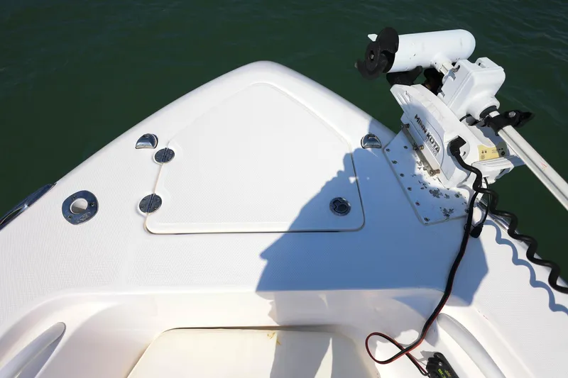 Slide: The Image of Bow of 2015 Everglades 355 Center Console with trolling motor on calm water. - 34