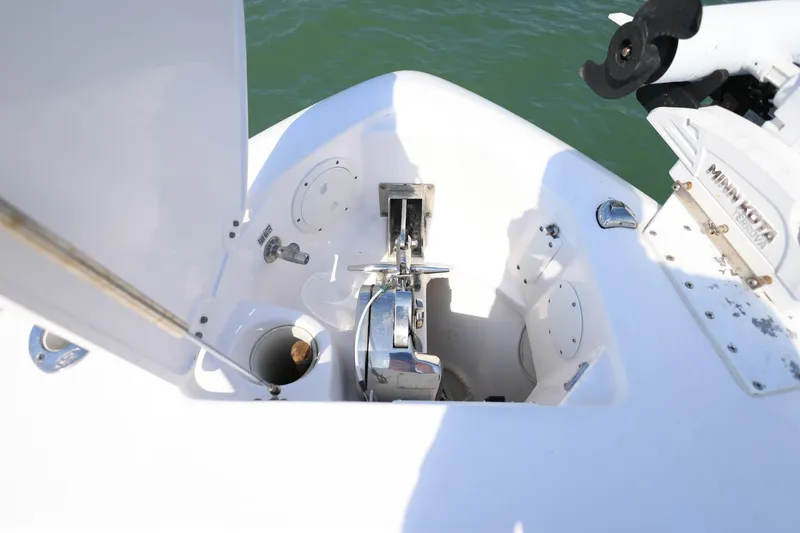 Slide: The Image of 2015 Everglades 355 Center Console boat anchor compartment with Minn Kota motor. - 35