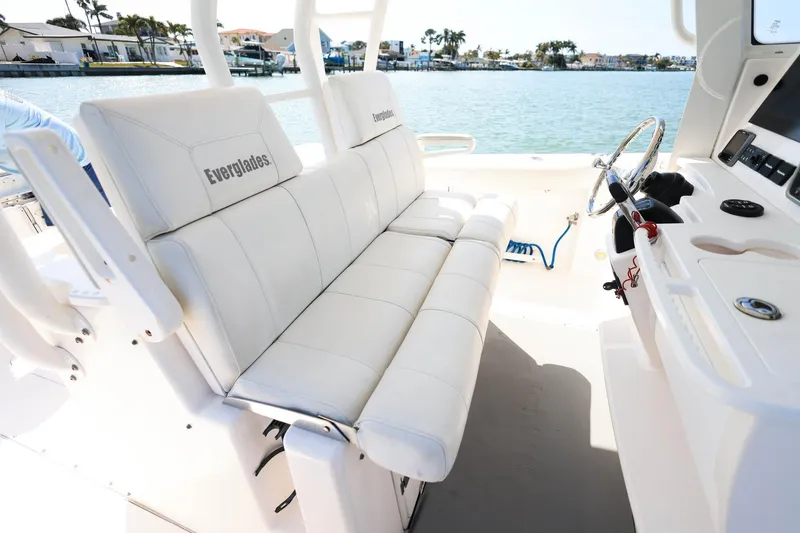 Slide: The Image of 2015 Everglades 355 Center Console boat interior with white seating and steering console. - 37