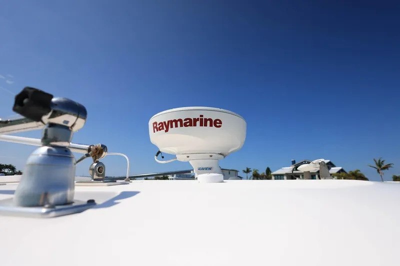 Slide: The Image of Radar equipment on 2015 Everglades 355 Center Console boat under clear blue sky. - 39