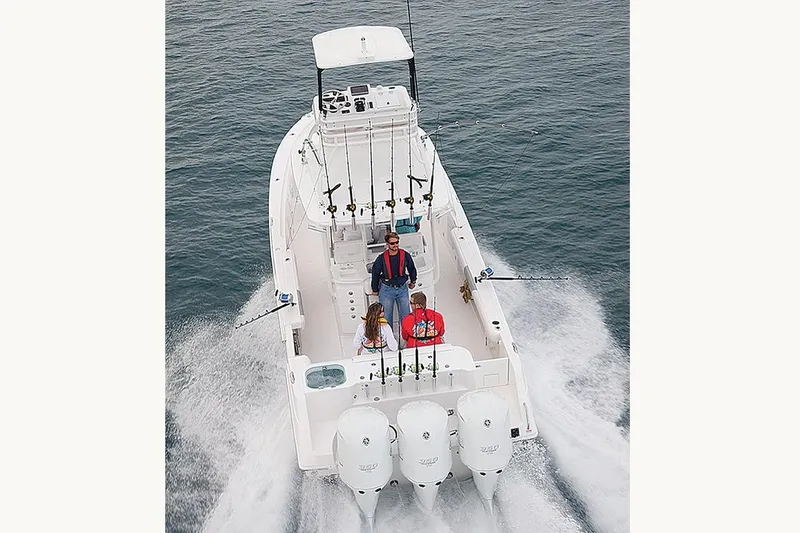 Slide: The Image of Overhead view of 2015 Everglades 355 Center Console boat on green water. - 4