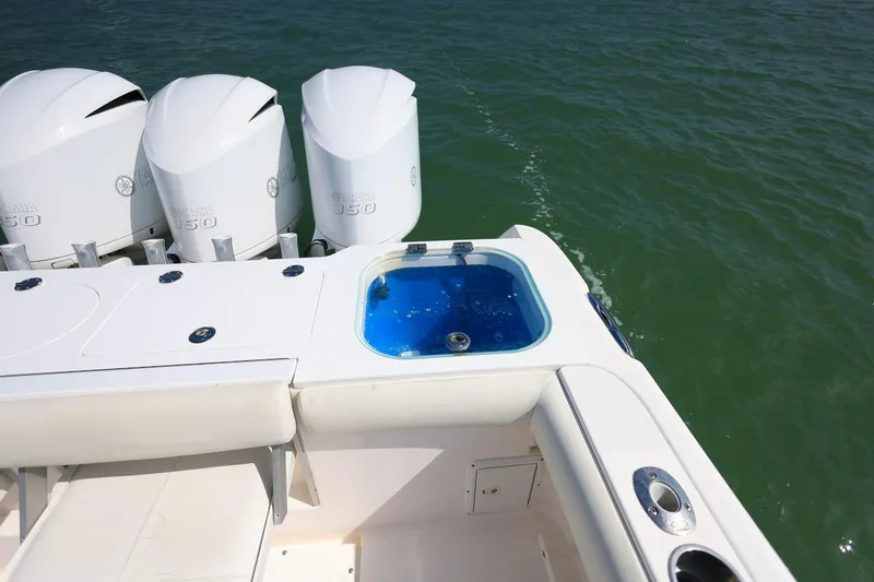 Slide: The Image of 2015 Everglades 355 Center Console boat with Yamaha 350 engines on open water. - 7