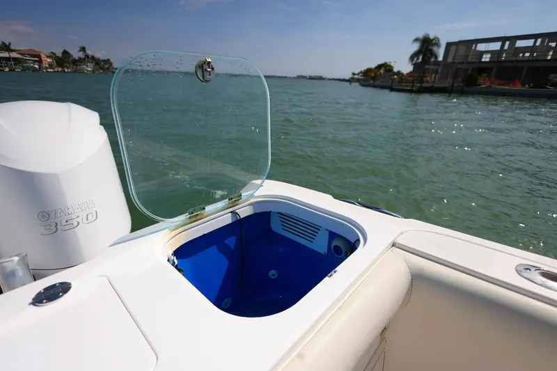 Slide: The Image of 2015 Everglades 355 Center Console boat with Yamaha 350 engine, open storage compartment. - 8