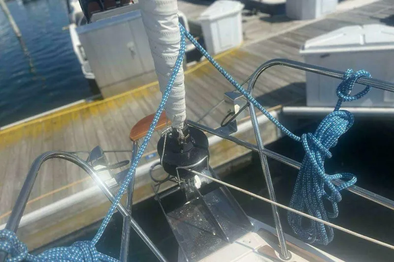 Slide: The Image of Jeanneau Sun Odyssey 39i sailboat bow with ropes, docked at marina, 2007 model. - 14