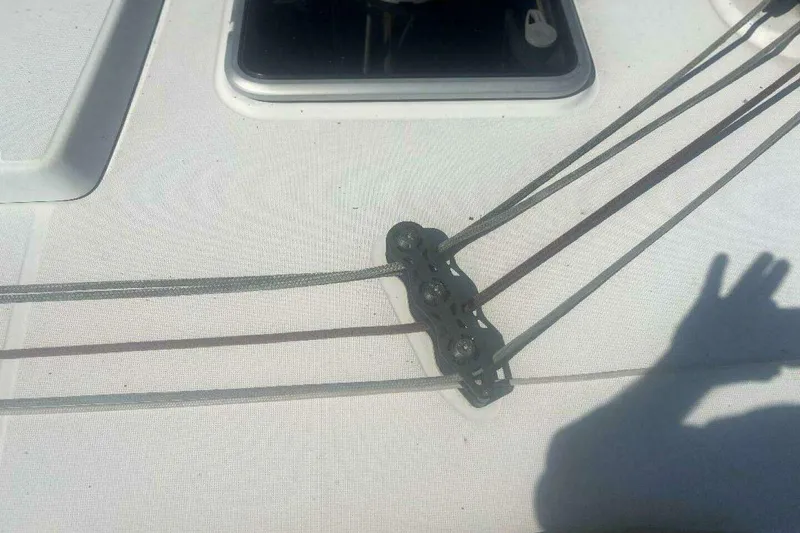 Slide: The Image of Deck of 2007 Jeanneau Sun Odyssey 39i sailboat with rigging lines and shadow. - 16