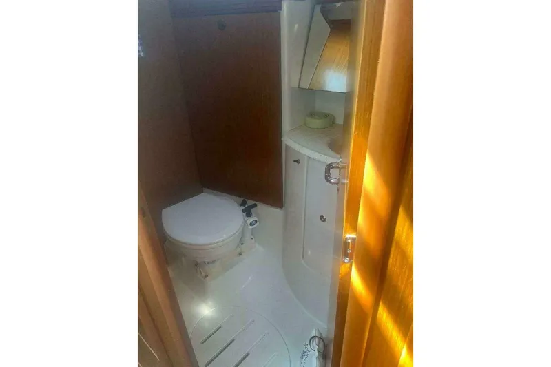 Slide: The Image of Bathroom interior of 2007 Jeanneau Sun Odyssey 39i yacht, featuring toilet and sink. - 27
