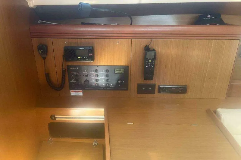 Slide: The Image of 2007 Jeanneau Sun Odyssey 39i interior control panel with communication equipment. - 29