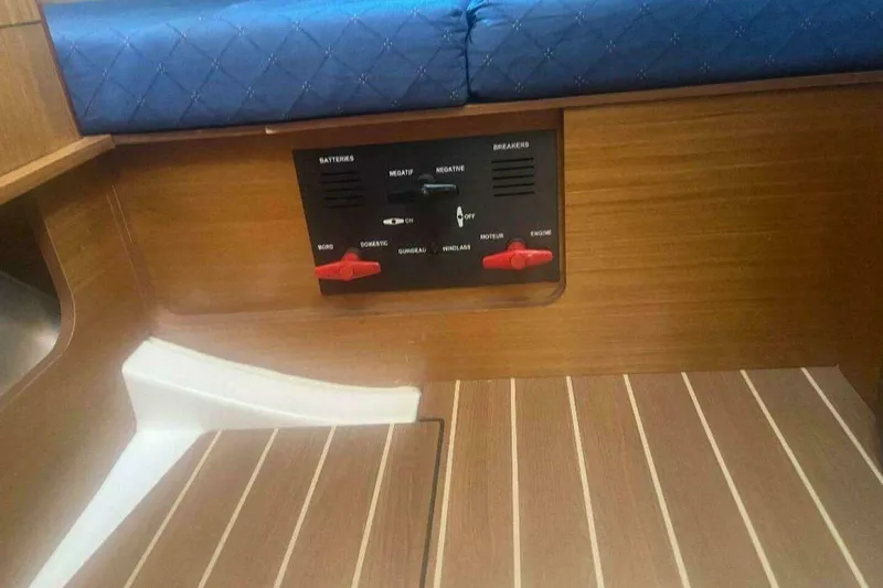 Slide: The Image of Interior of 2007 Jeanneau Sun Odyssey 39i yacht showing control panel and wooden flooring. - 33