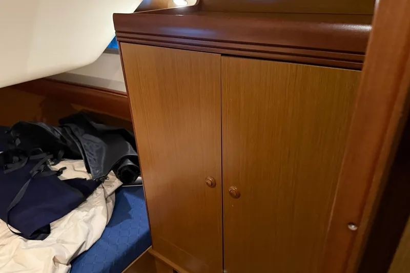 Slide: The Image of Interior of 2007 Jeanneau Sun Odyssey 39i with wooden cabinet and bed. - 44
