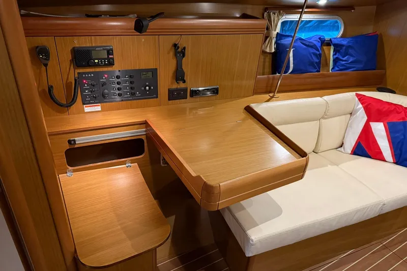 Slide: The Image of Interior of 2007 Jeanneau Sun Odyssey 39i yacht with navigation station and seating area. - 47