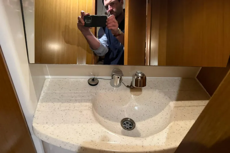 Slide: The Image of Bathroom sink area in 2007 Jeanneau Sun Odyssey 39i yacht, featuring a speckled countertop. - 55