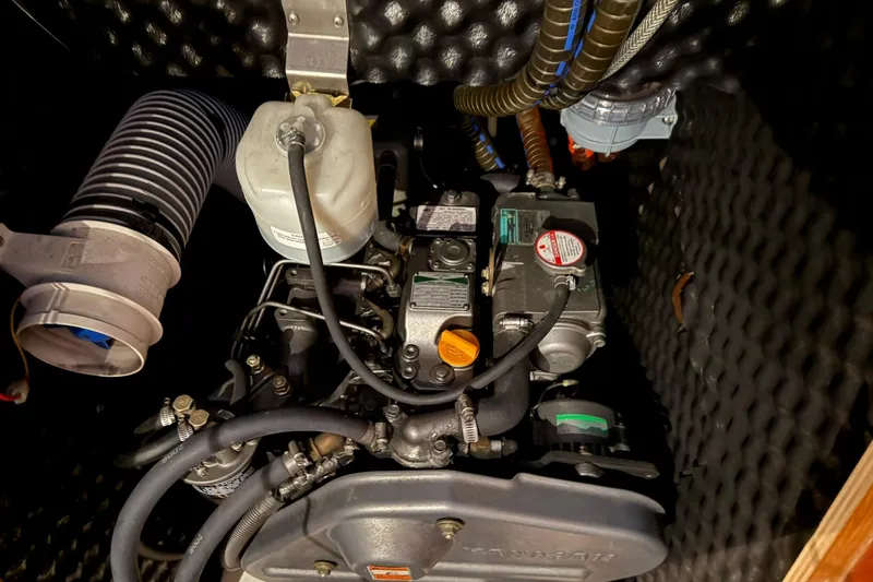 Slide: The Image of Engine compartment of a 2007 Jeanneau Sun Odyssey 39i sailboat, showcasing mechanical components. - 57