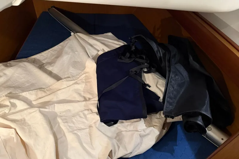 Slide: The Image of Sailing gear and covers inside a 2007 Jeanneau Sun Odyssey 39i cabin. - 59