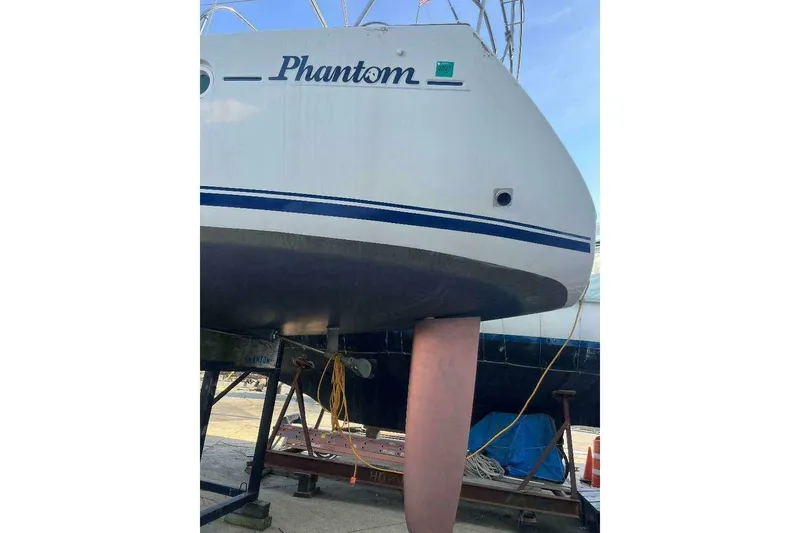 Slide: The Image of 2007 Jeanneau Sun Odyssey 39i sailboat on dry dock, named "Phantom." - 7