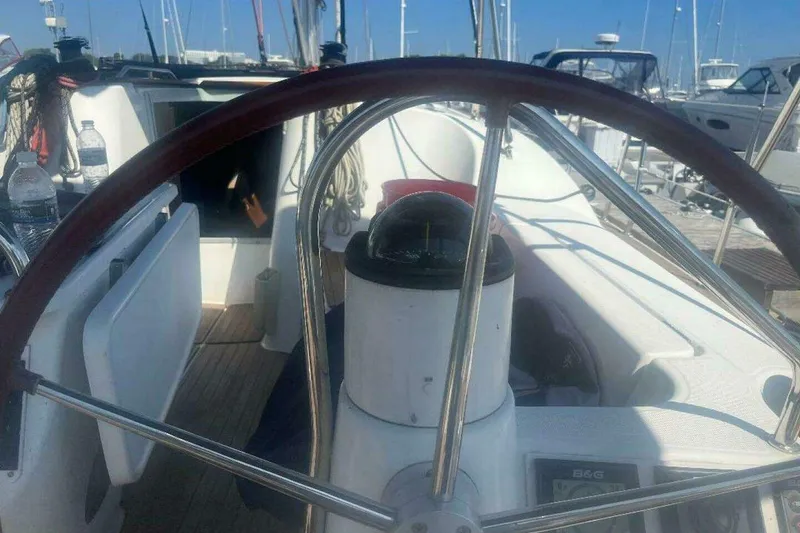 Slide: The Image of Steering wheel of 2007 Jeanneau Sun Odyssey 39i sailboat in marina setting. - 9