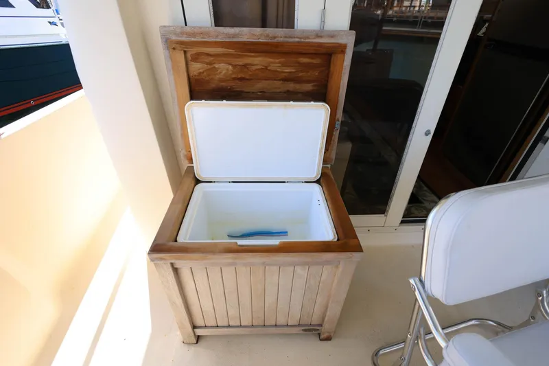 Slide: The Image of Wooden storage box with open lid on 2005 Mainship 40 Trawler boat deck. - 11