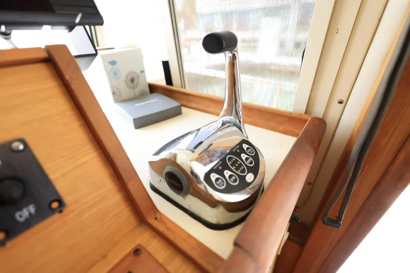 Slide: The Image of Control lever on 2005 Mainship 40 Trawler, featuring a sleek chrome finish. - 24