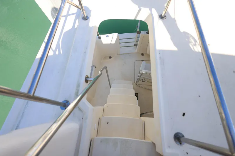 Slide: The Image of Staircase on 2005 Mainship 40 Trawler, leading to lower deck with railing. - 29