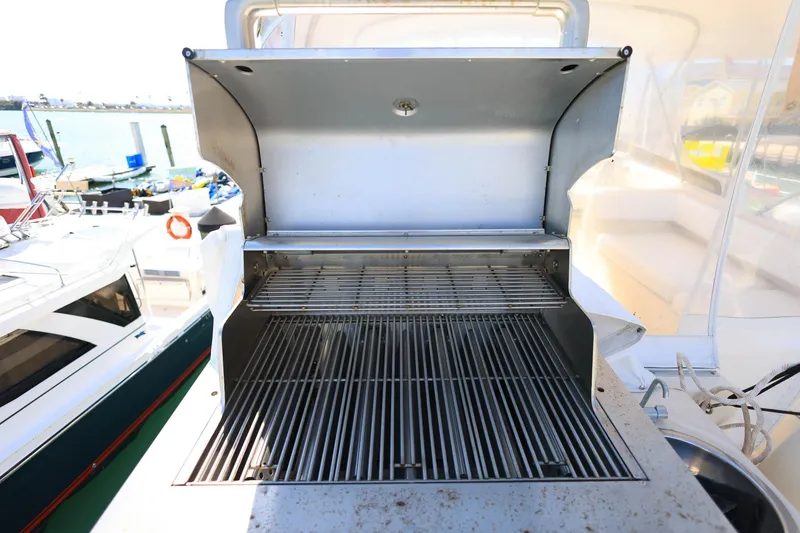 Slide: The Image of Outdoor grill on 2005 Mainship 40 Trawler yacht, docked at marina. - 33
