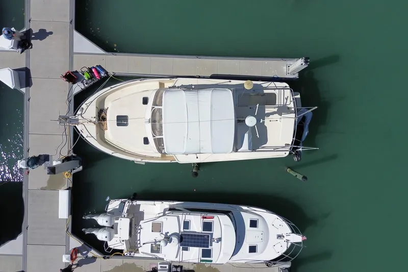 Slide: The Image of Overhead view of a 2005 Mainship 40 Trawler docked at a marina. - 7