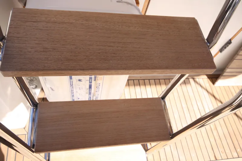 Slide: The Image of Wooden steps on a 1983 Grand Banks 32 Sedan boat ladder. - 11