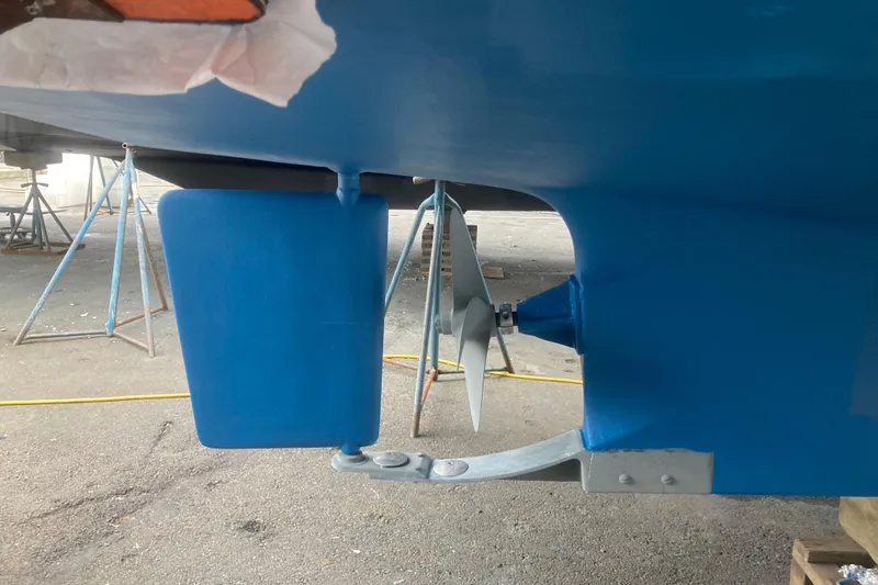 Slide: The Image of 1983 Grand Banks 32 Sedan boat propeller and rudder in dry dock. - 57