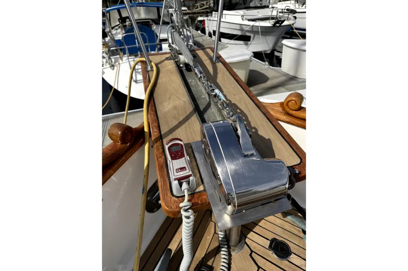Slide: The Image of 1983 Grand Banks 32 Sedan boat deck with anchor chain and winch system. - 63
