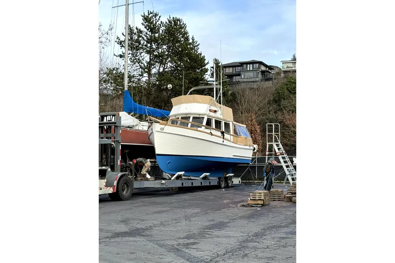 Slide: The Image of 1983 Grand Banks 32 Sedan boat on trailer, ready for transport. - 67