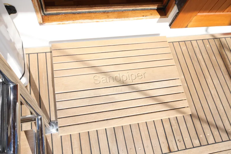Slide: The Image of Teak deck of 1983 Grand Banks 32 Sedan with "Sandpiper" engraved mat. - 7