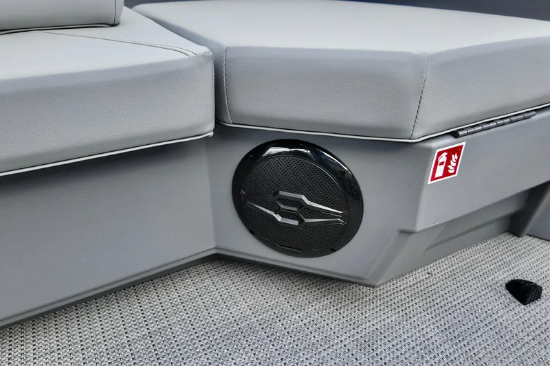 Slide: The Image of 2026 Sylvan A-22 LZ DH SPORT boat interior with speaker and fire extinguisher label. - 11