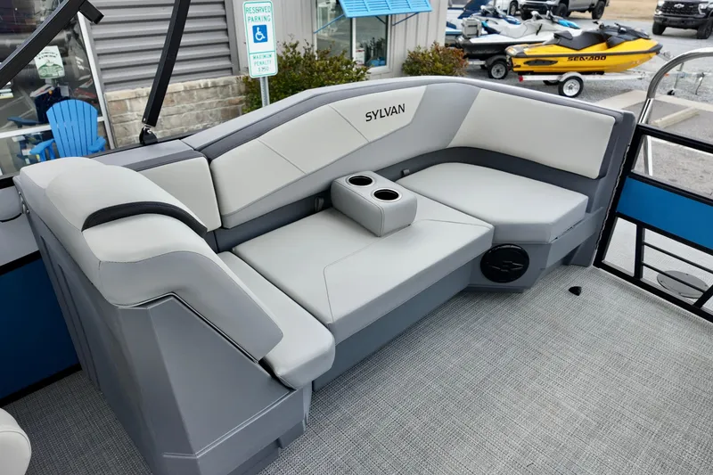 Slide: The Image of 2026 Sylvan A-22 LZ DH SPORT boat interior with gray seating and cup holders. - 17