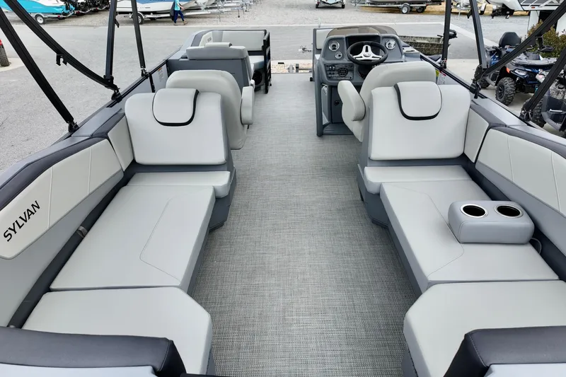 Slide: The Image of 2026 Sylvan A-22 LZ DH SPORT pontoon boat interior with modern seating and helm. - 22