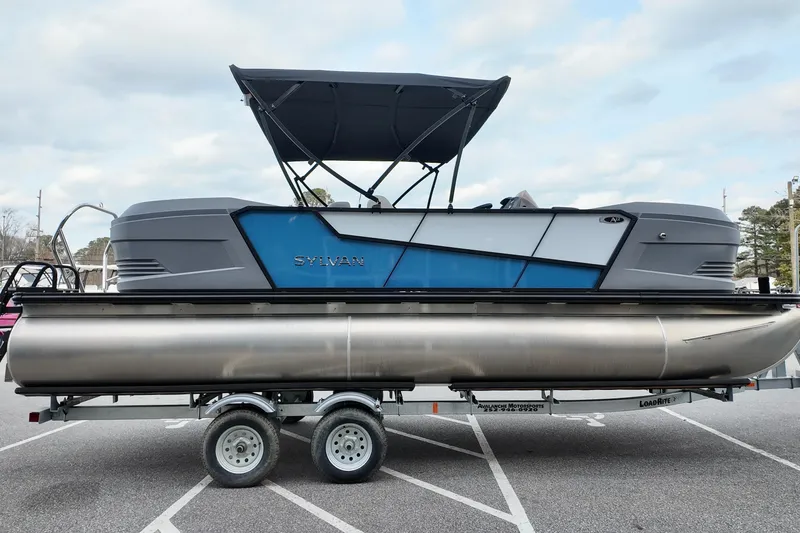 Slide: The Image of 2026 Sylvan A-22 LZ DH SPORT pontoon boat on trailer, featuring sleek design and canopy. - 5