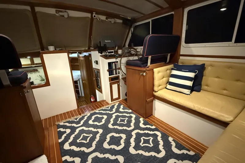 Slide: The Image of Luxurious interior of 1987 Wilbur 38 yacht with elegant seating and nautical decor. - 14