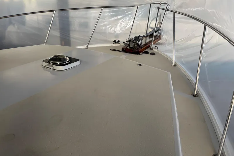 Slide: The Image of 1987 Wilbur 38 boat deck with railing and hatch, under protective cover. - 33