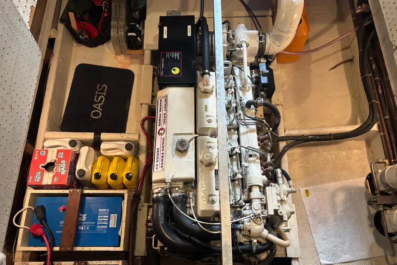 Slide: The Image of Engine room of a 1987 Wilbur 38 boat with organized equipment and components. - 40