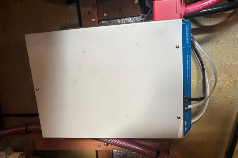 Slide: The Image of Electrical component in a 1987 Wilbur 38 boat, featuring Xantrex inverter installation. - 44