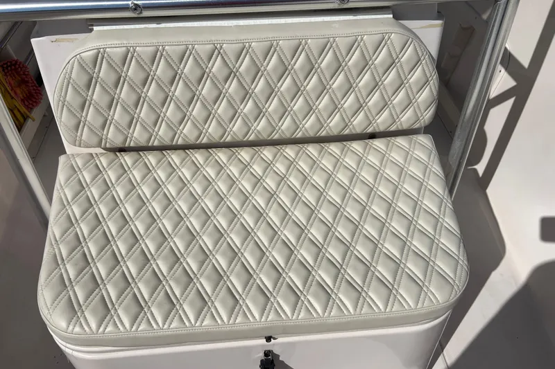 Slide: The Image of Quilted seat cushion on 1999 Grady-White Escape 209 boat, showcasing elegant design. - 13