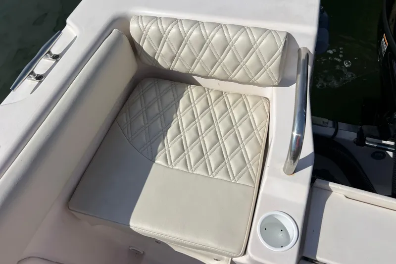 Slide: The Image of 1999 Grady-White Escape 209 boat seat with diamond-stitched upholstery and cup holder. - 18