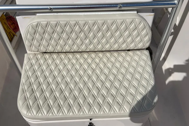Slide: The Image of Diamond-stitched white seat on 1999 Grady-White Escape 209 boat. - 28