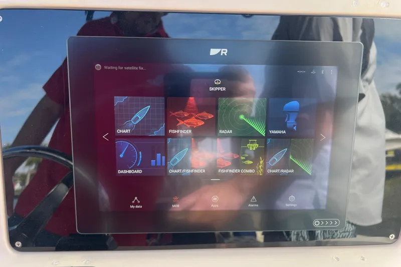 Slide: The Image of Touchscreen display on a 1999 Grady-White Escape 209 boat showing navigation and radar options. - 29