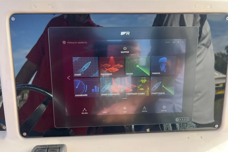 Slide: The Image of Touchscreen display on 1999 Grady-White Escape 209 boat showing navigation and radar apps. - 30